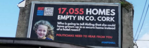 A billboard on a busy road in Co. Cork saying '17,055 homes empty in Co. Cork;