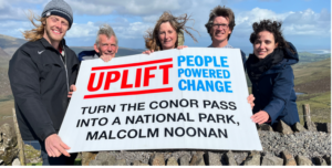 Photo of campaigners at the Conor Pass holding a banner